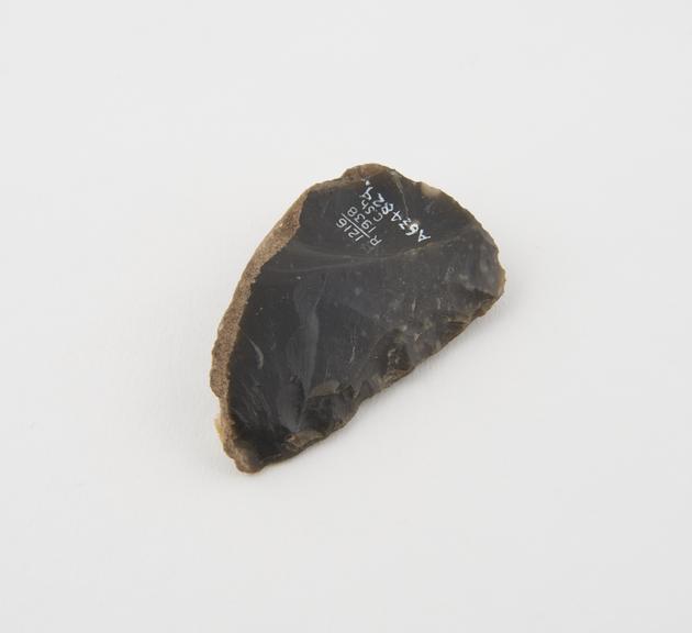 Flint side scraper, Mousterian, black flint with some cortex