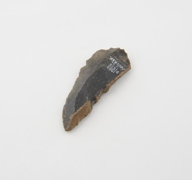 Knife blade, dark grey flint, Mousterian, from Le Moustier