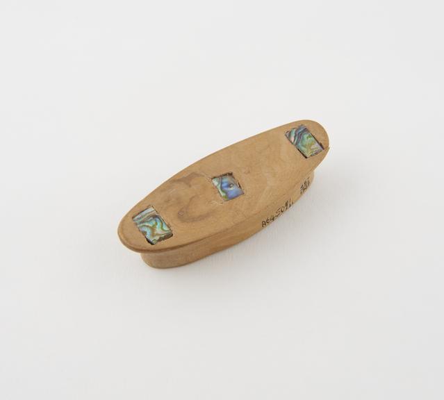 wooden labret or lip plug, crudely inlaid with abalone shell