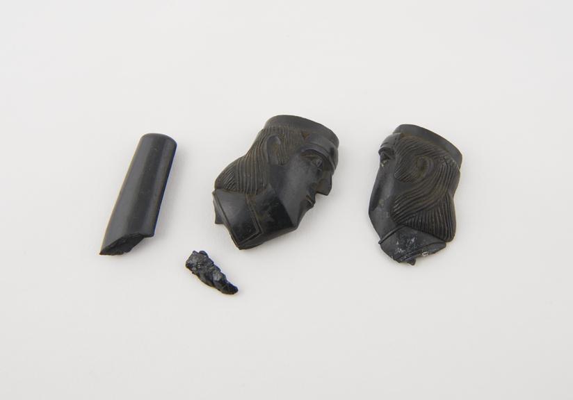 Black argalite tobacco pipe, bowl in the form of a Roman head