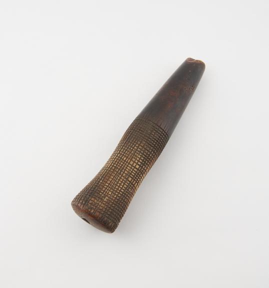 Ivory bark beater, possibly also used as a pestle