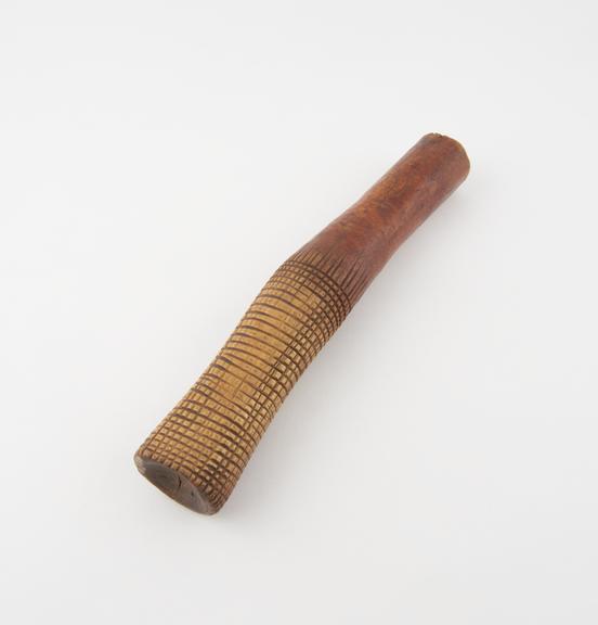 Ivory bark beater, possibly also used as a pestle