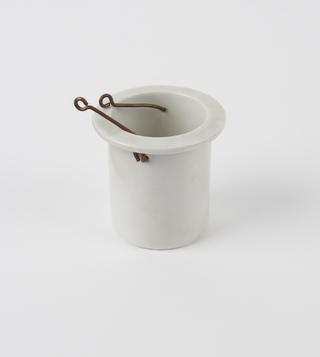 White pot with hooks