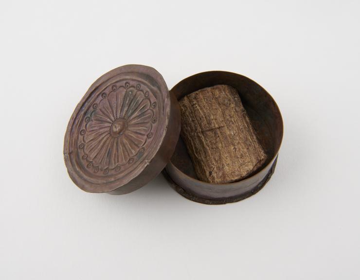 Amulet, a copper box containing a piece of wood and bark