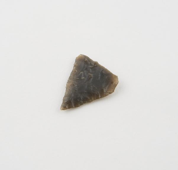 Fragment of flint arrowhead, tip only