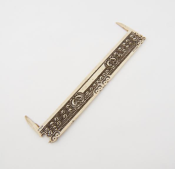 Carved ivory comb, in poor condition