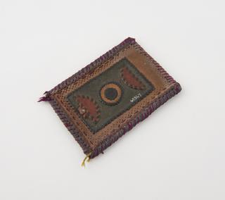 Amulet consisting of ornamental leather case
