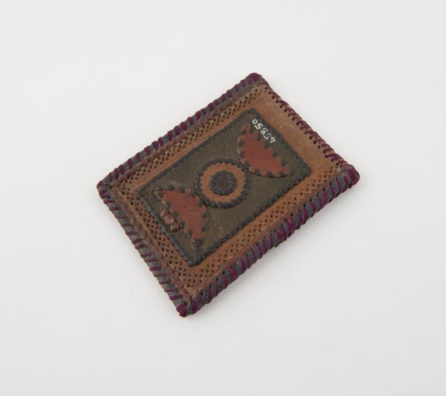 Amulets consisting of ornamental leather case, polychrome