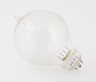 One of four early Swan bamboo filament lamps rated: (a) 65v