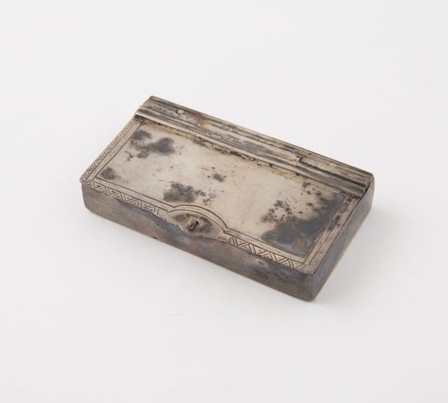 Tinder-box (length 2 1/4 ins) of silver; rectangular