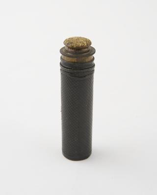 A Lighter in form of a cylindrical leather-covered