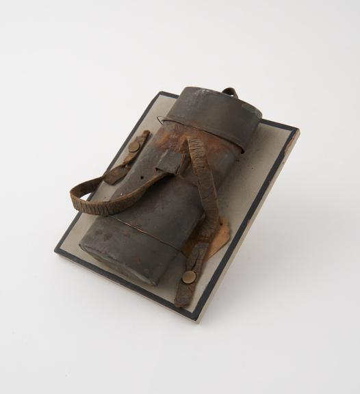 Tinder-box (depth 4 ins) of thin iron; canister-shaped, oval