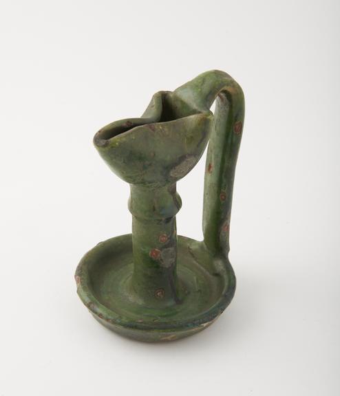 Green glaze candlestick-shaped lipped dish, Algiers