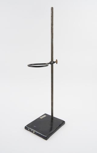 Metal stand with loop to rest or hold apparatus