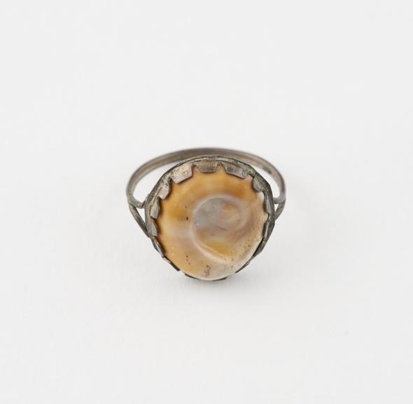 Metal finger ring, set with an operculum, probably an amulet
