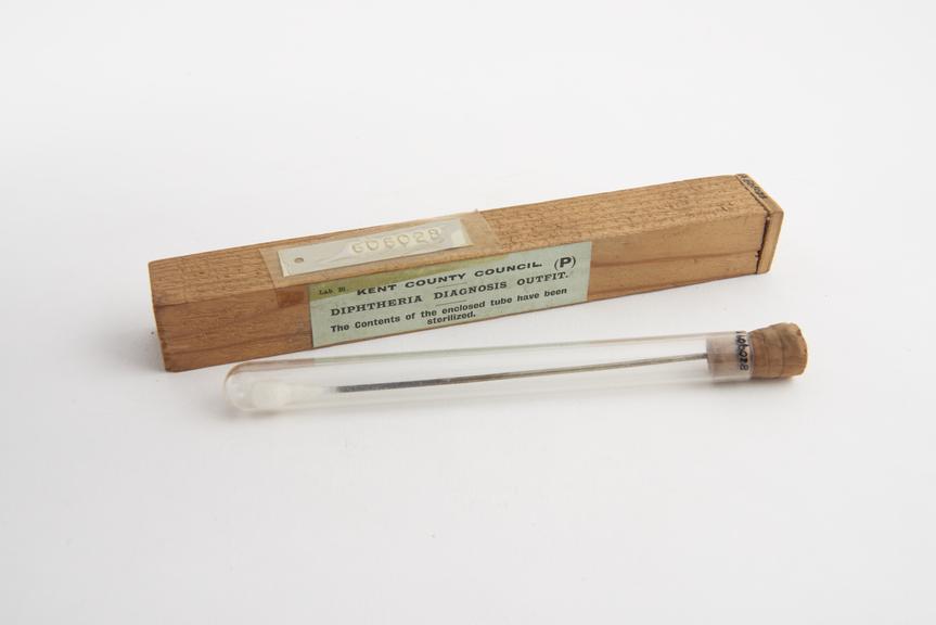 Swab, cotton wool on metal rod in glass tube, in wooden case