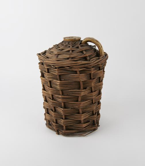 Stone winchester in wicker holder