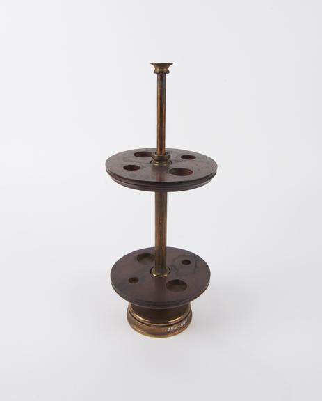 Revolving stand, possibly for four pipettes