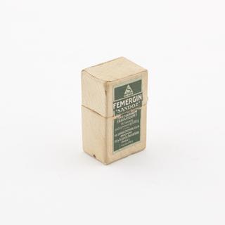 Glass bottle with metal screw cap inside packet