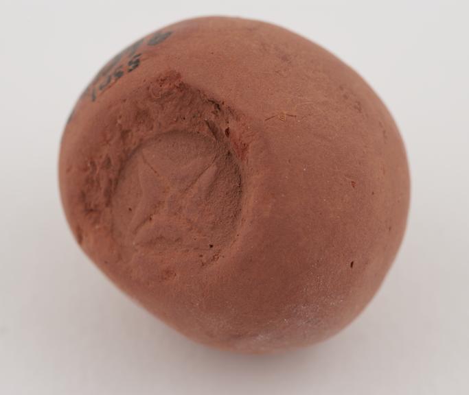 Spherical red terra sigillata stamped with Maltese Cross