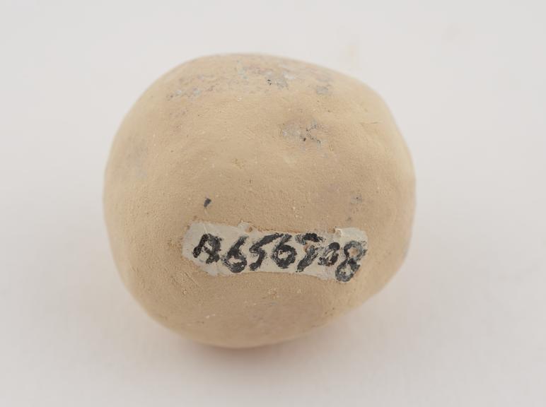 Buff coloured terra sigillata roughly spherical