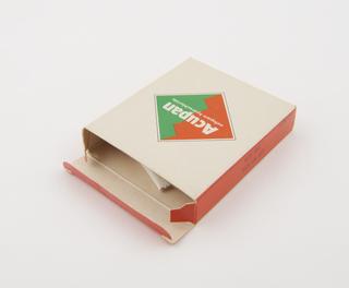 Glass bottle with plastic screw cap containing "Gentylan" brand sodium gentisate tablets