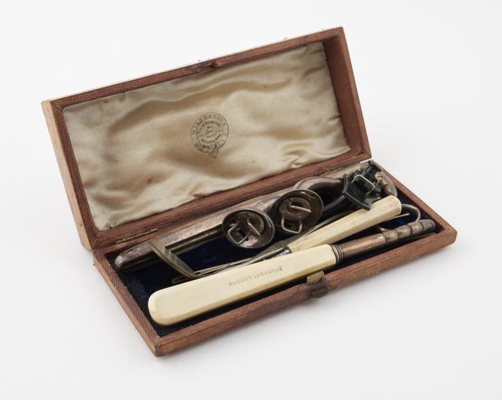 Set of 9 tracheotomy instruments in leather case made by Walsh