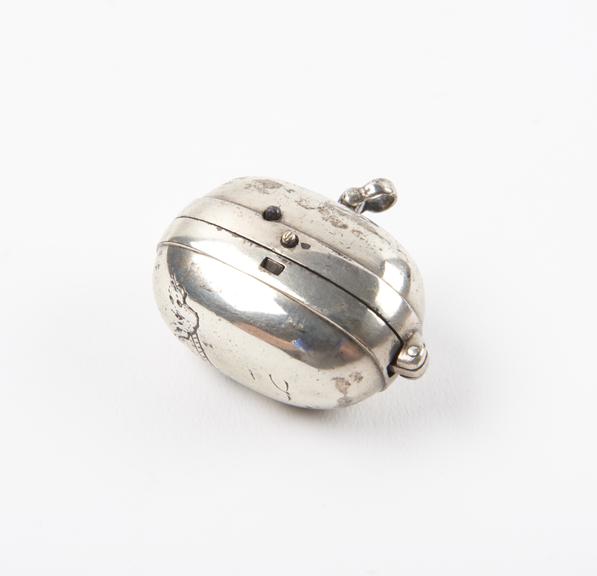 Locket-like Pistol Tinder-box (length 1 1/2 in) of bright