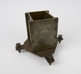 One of four rectangular bronze cubic measures for 60 cubic inches with square glass strike