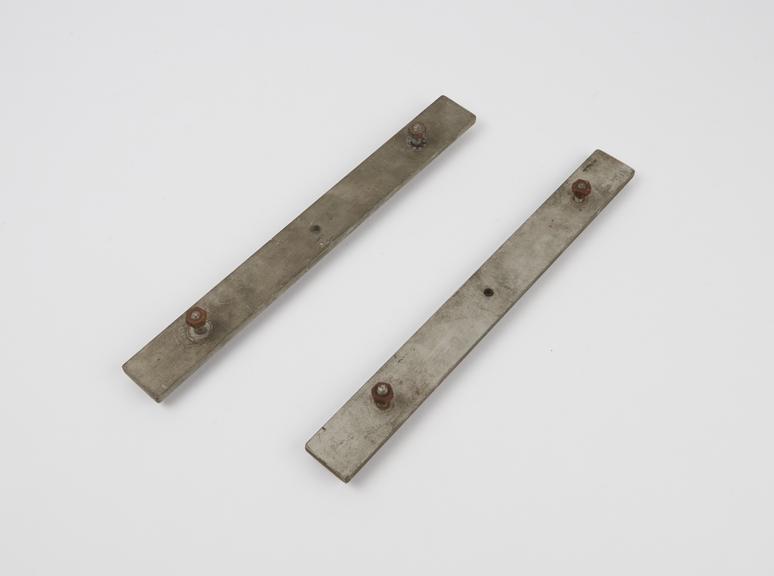 Metal bars for joining cabinets together in the Elliott / NRDC