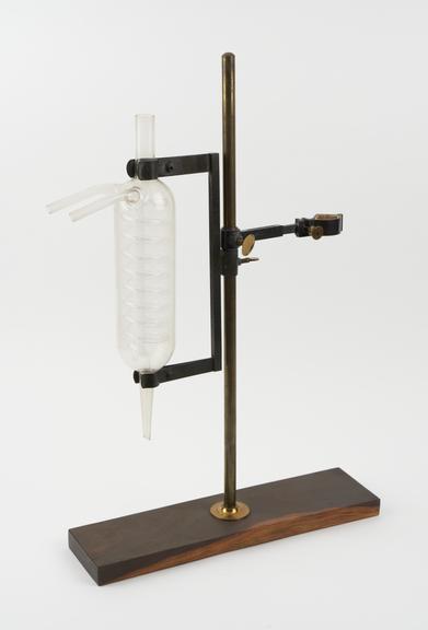 Double retort stand, glass tube still and two flasks from Dr