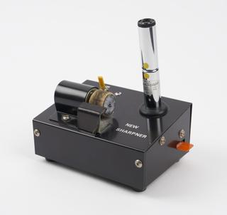 Battery driven 'Style Scope' microscope and needle sharpener