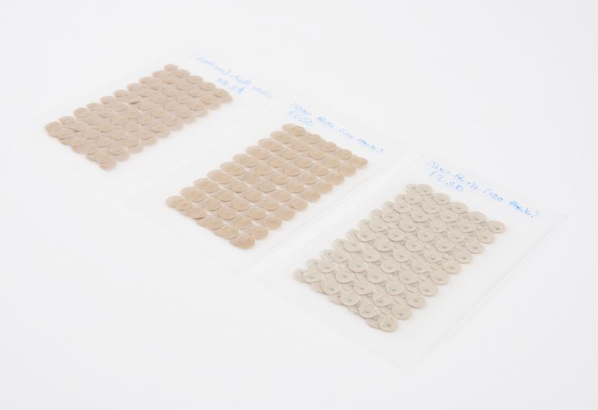 Two packets, containing one hundred adhesive silver points for acupuncture
