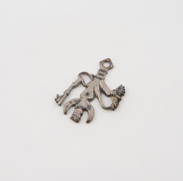 Silver amulet or cimaruta, in the form of a sprig of rue