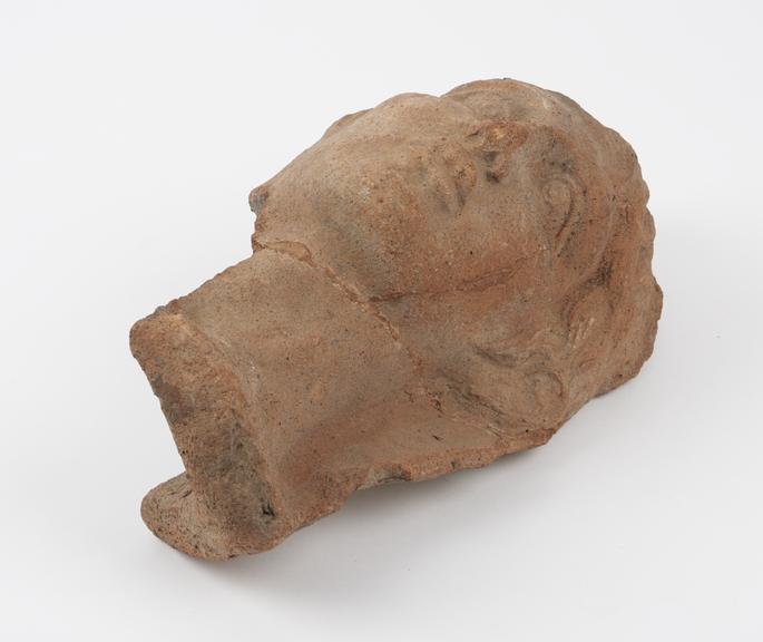 Incomplete votive female head, terracotta, hollow