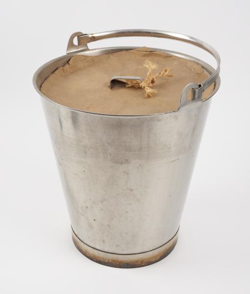 Stainless steel bucket used for washing glassware in the