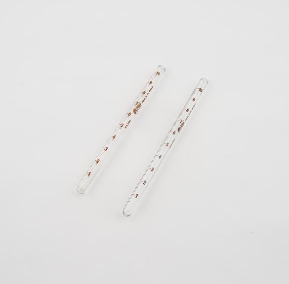 Two Wintrobe haematocrit tubes by EMIL Gold Line Britain.
