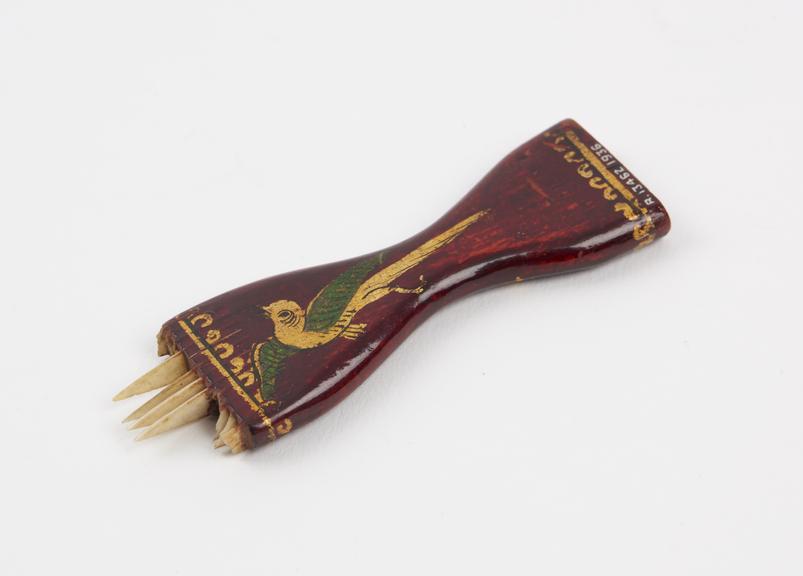 Small lacquered wooden comb, originally with many teeth