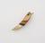 amuletic animal tooth painted with red