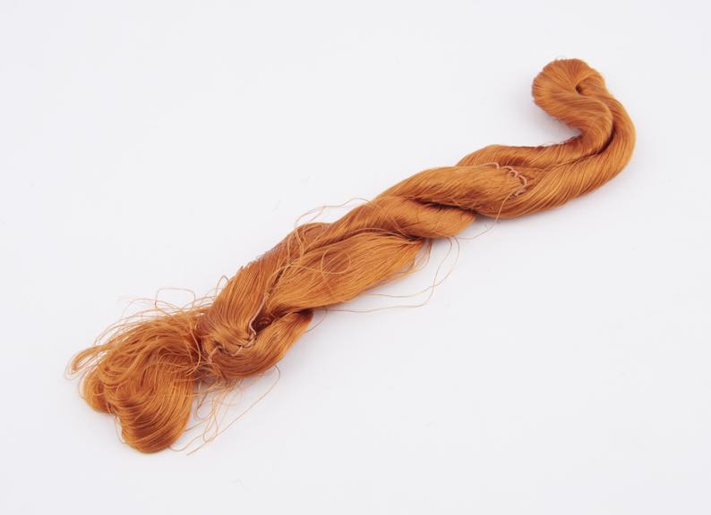 Orange viscose skein with associated label Mr Heaven