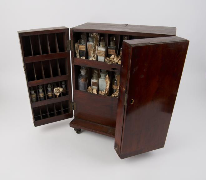 Portable chemical cabinet in polished mahogany box on small