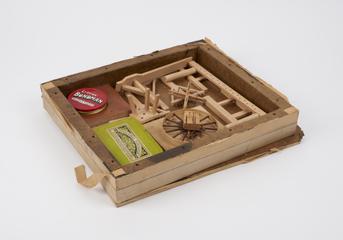 Miscellaneous wooden box with rope making paraphernalia. Includes a 'Lloyds' Bondman' red tin