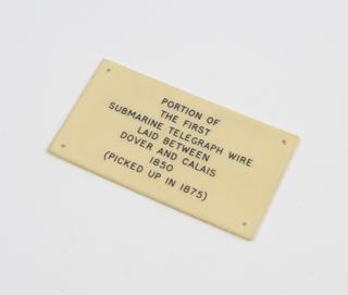Ivorine label for portion of the first submarine cable between Dover and Calais, 1875-1913
