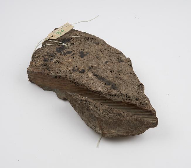 Specimen of rock worn by cable