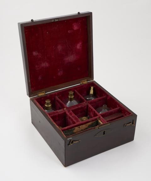 Cupping set in red velvet lined mahogany case