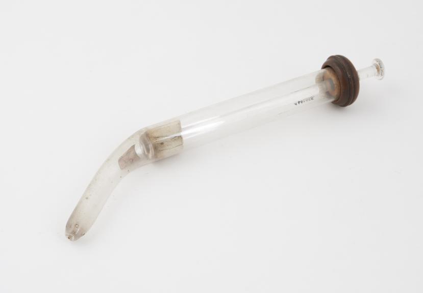 Glass piston action vaginal syringe