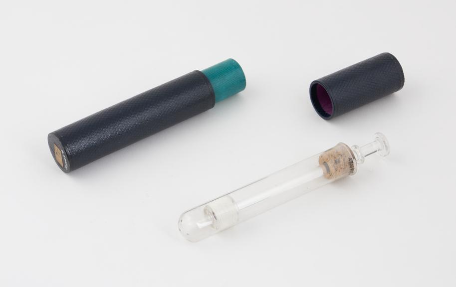 Glass vaginal syringe, in cardboard case, piston action