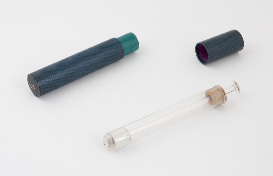 Glass vaginal syringe, piston action, in cardboard case