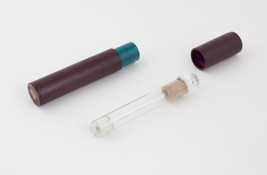 Glass vaginal syringe, piston action, in cardboard case