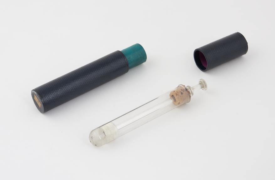 Glass vaginal syringe, piston action, in cardboard case